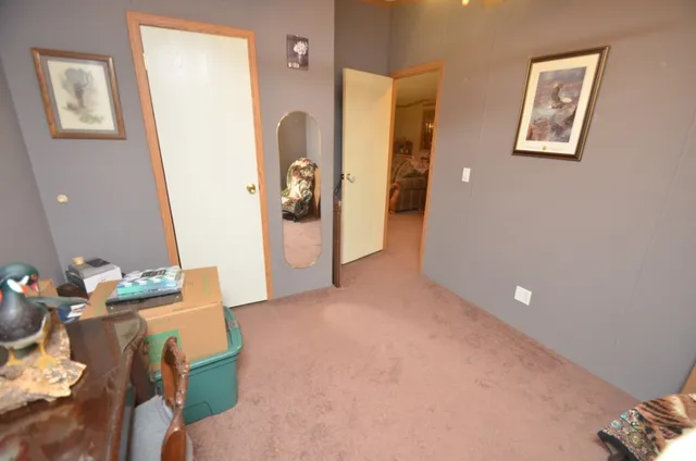 a view of a livingroom with furniture and entryway