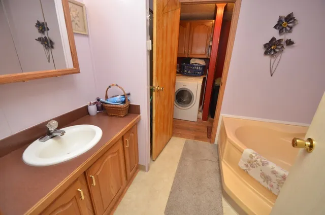 a bathroom with a sink and a mirror