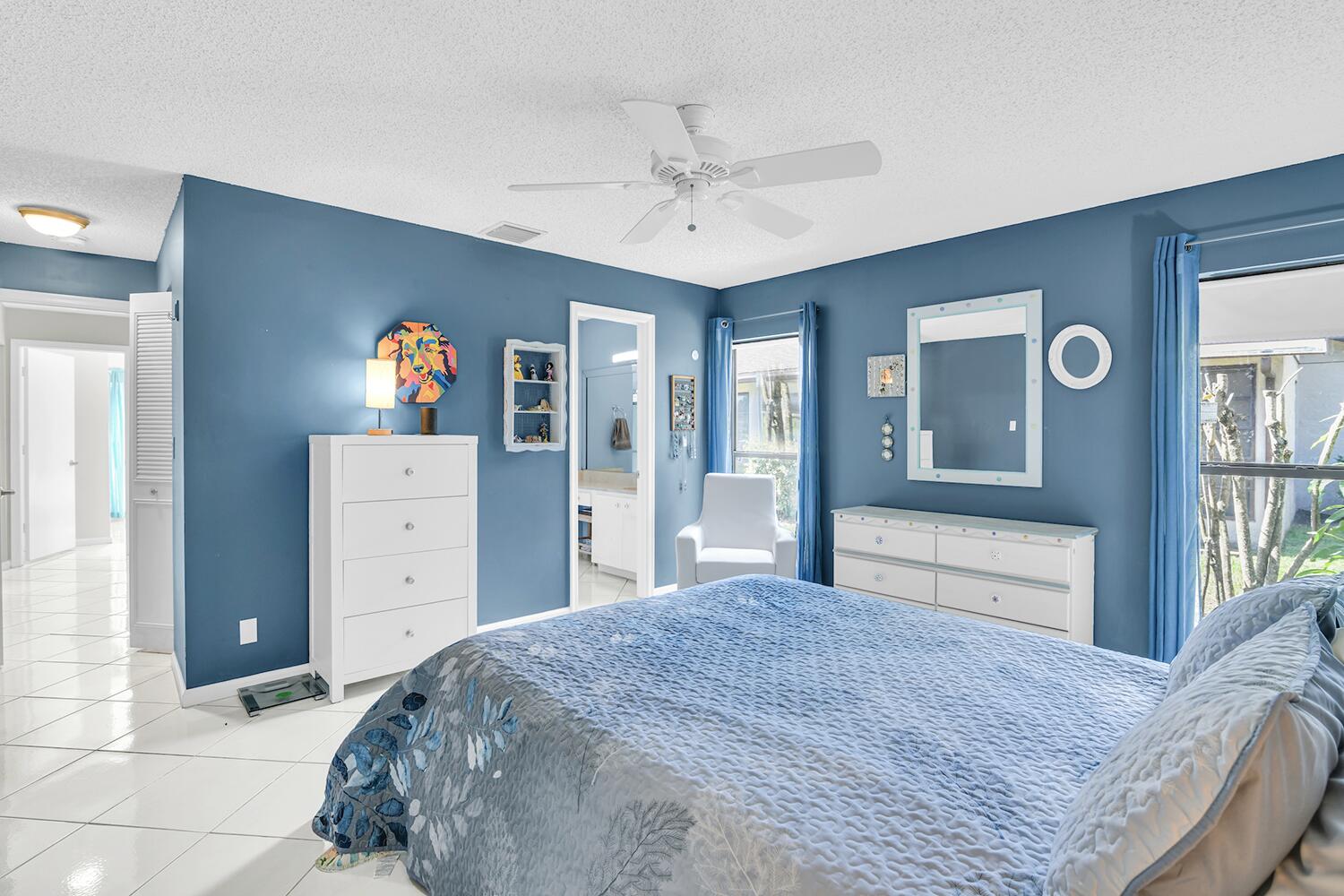 6335 Hitchin Post Way Delray Beach, FL 33484 - Photo 11 of 33 a bedroom with a bed and a dresser