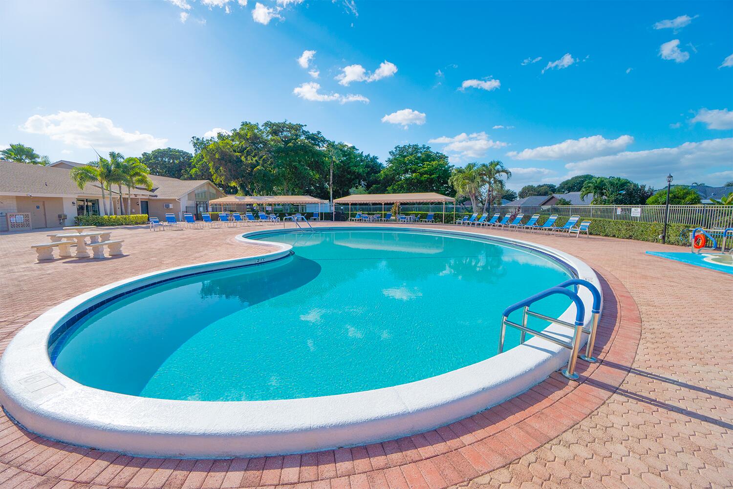 6335 Hitchin Post Way Delray Beach, FL 33484 - Photo 18 of 33 a view of a swimming pool with a patio