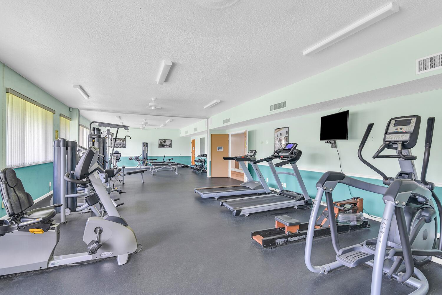 6335 Hitchin Post Way Delray Beach, FL 33484 - Photo 19 of 33 a view of a room with gym equipment