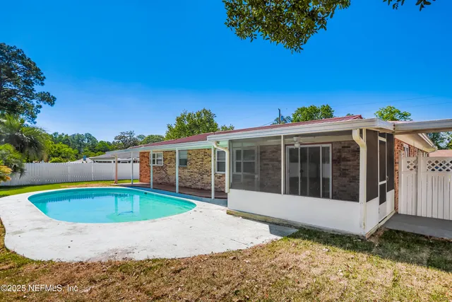 a view of a house with a swimming pool