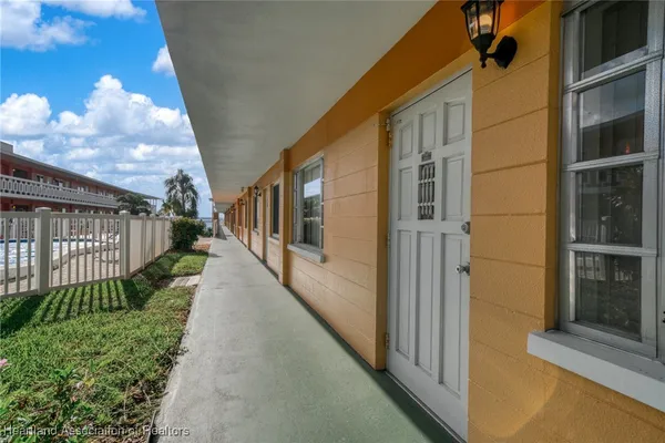 a view of a house with a small yard