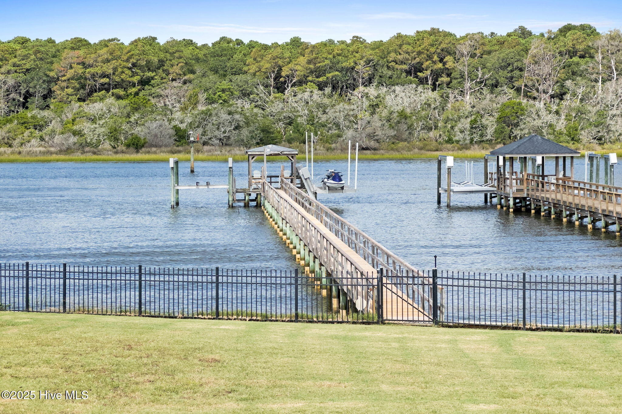 57 Craven Street Ocean Isle Beach, NC 28469 - Photo 7 of 85 Exceptional ICW-front home featuring 5 bedrooms, 5.5 baths, breathtaking water views, private dock with boat lift, and a resort-style outdoor space with pool, porches, and deck.