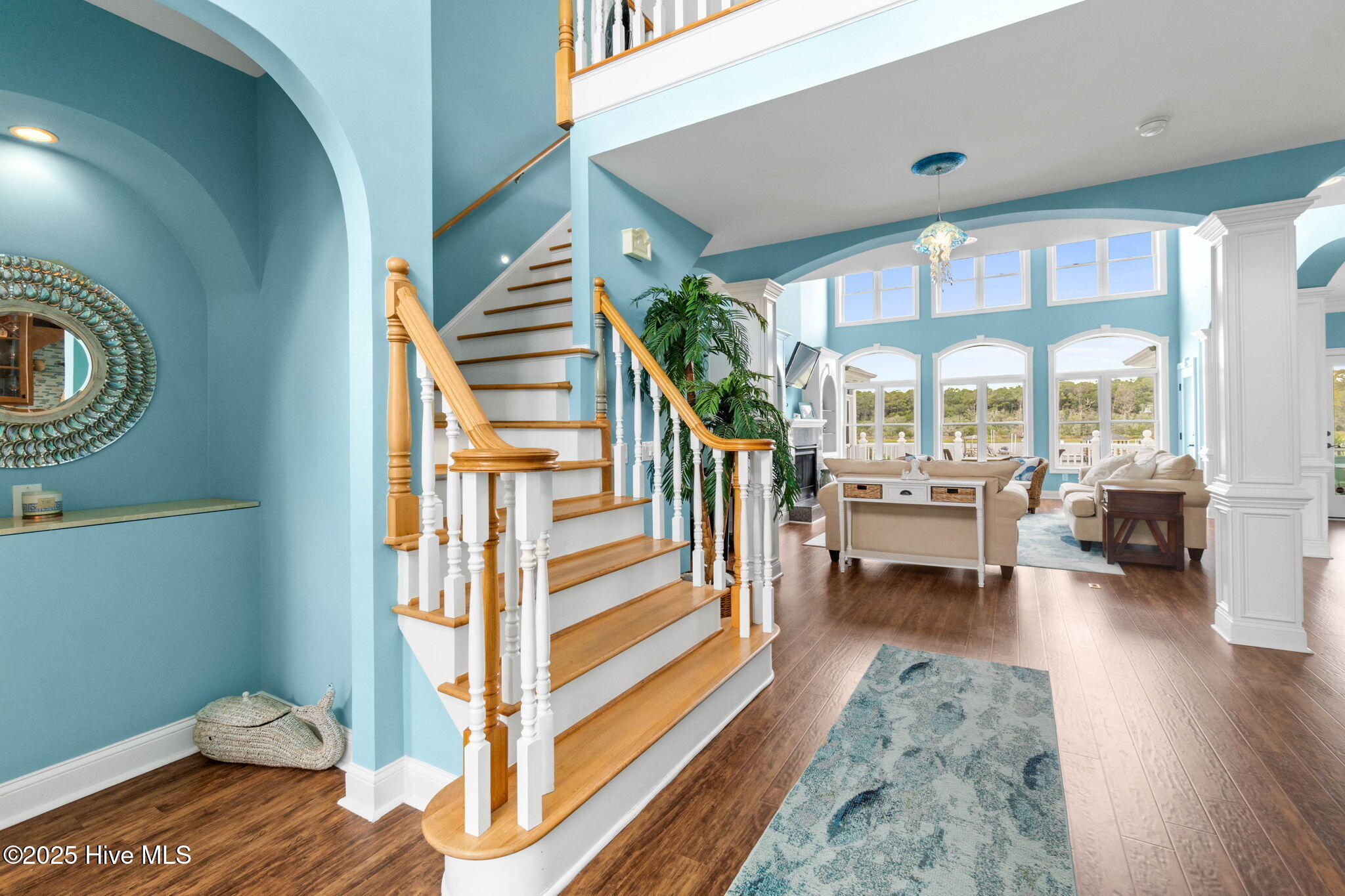 57 Craven Street Ocean Isle Beach, NC 28469 - Photo 11 of 85 Exceptional ICW-front home featuring 5 bedrooms, 5.5 baths, breathtaking water views, private dock with boat lift, and a resort-style outdoor space with pool, porches, and deck.