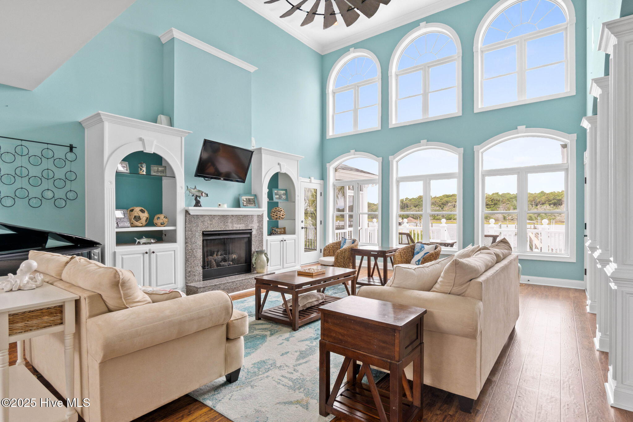 57 Craven Street Ocean Isle Beach, NC 28469 - Photo 13 of 85 Exceptional ICW-front home featuring 5 bedrooms, 5.5 baths, breathtaking water views, private dock with boat lift, and a resort-style outdoor space with pool, porches, and deck.