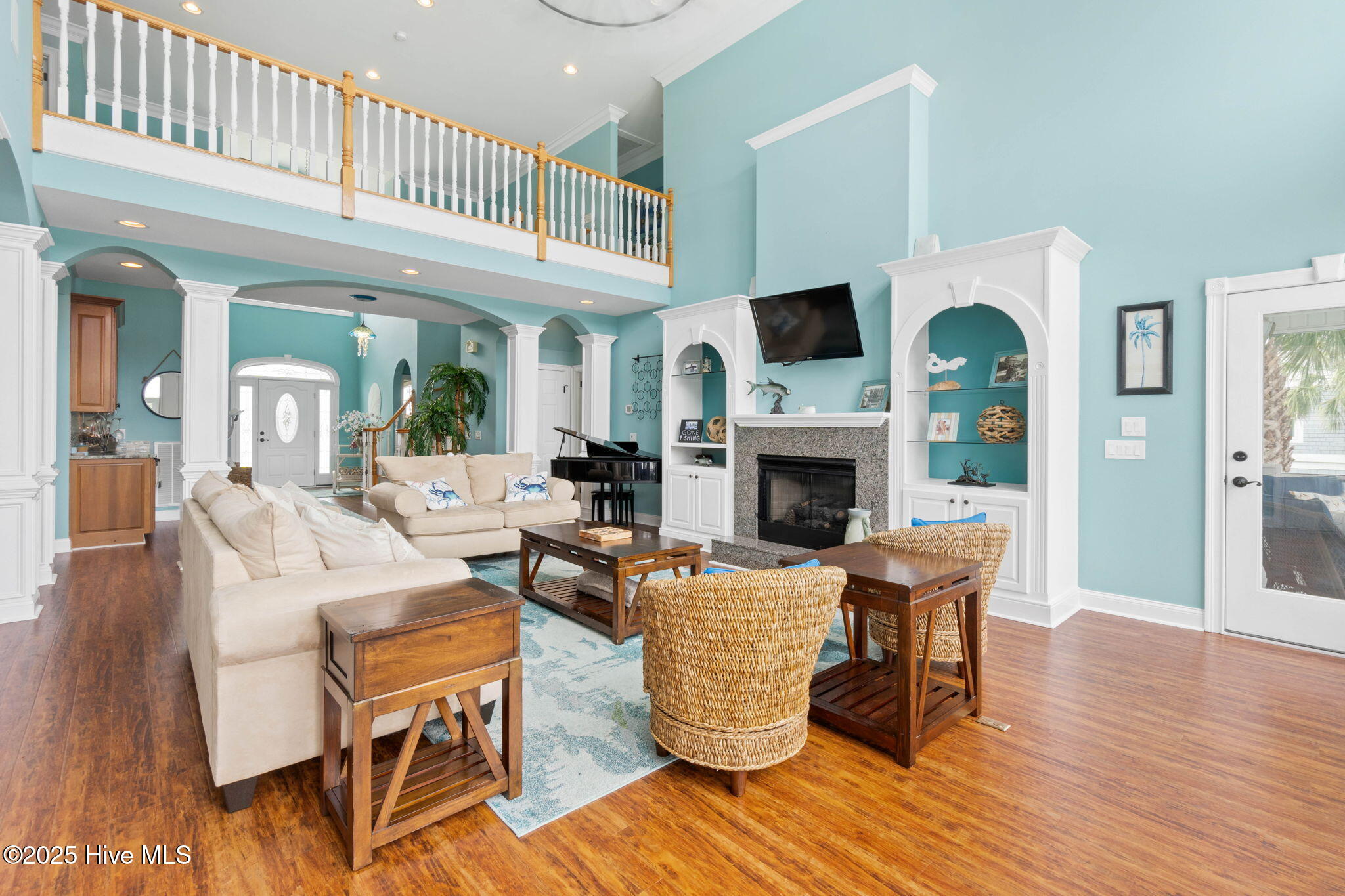 57 Craven Street Ocean Isle Beach, NC 28469 - Photo 15 of 85 Exceptional ICW-front home featuring 5 bedrooms, 5.5 baths, breathtaking water views, private dock with boat lift, and a resort-style outdoor space with pool, porches, and deck.