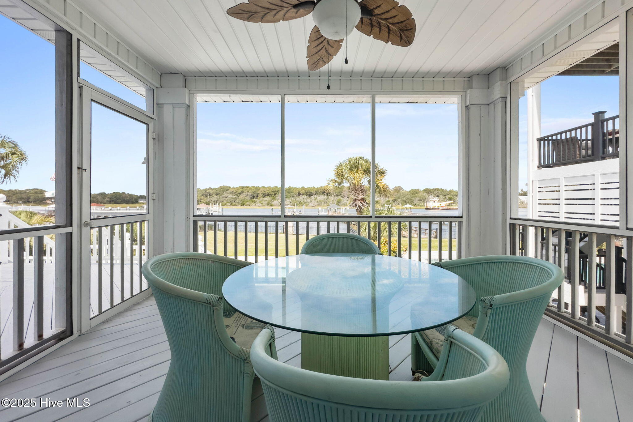 57 Craven Street Ocean Isle Beach, NC 28469 - Photo 25 of 85 Exceptional ICW-front home featuring 5 bedrooms, 5.5 baths, breathtaking water views, private dock with boat lift, and a resort-style outdoor space with pool, porches, and deck.