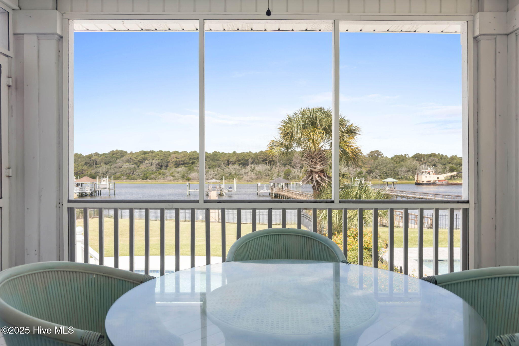57 Craven Street Ocean Isle Beach, NC 28469 - Photo 26 of 85 Exceptional ICW-front home featuring 5 bedrooms, 5.5 baths, breathtaking water views, private dock with boat lift, and a resort-style outdoor space with pool, porches, and deck.