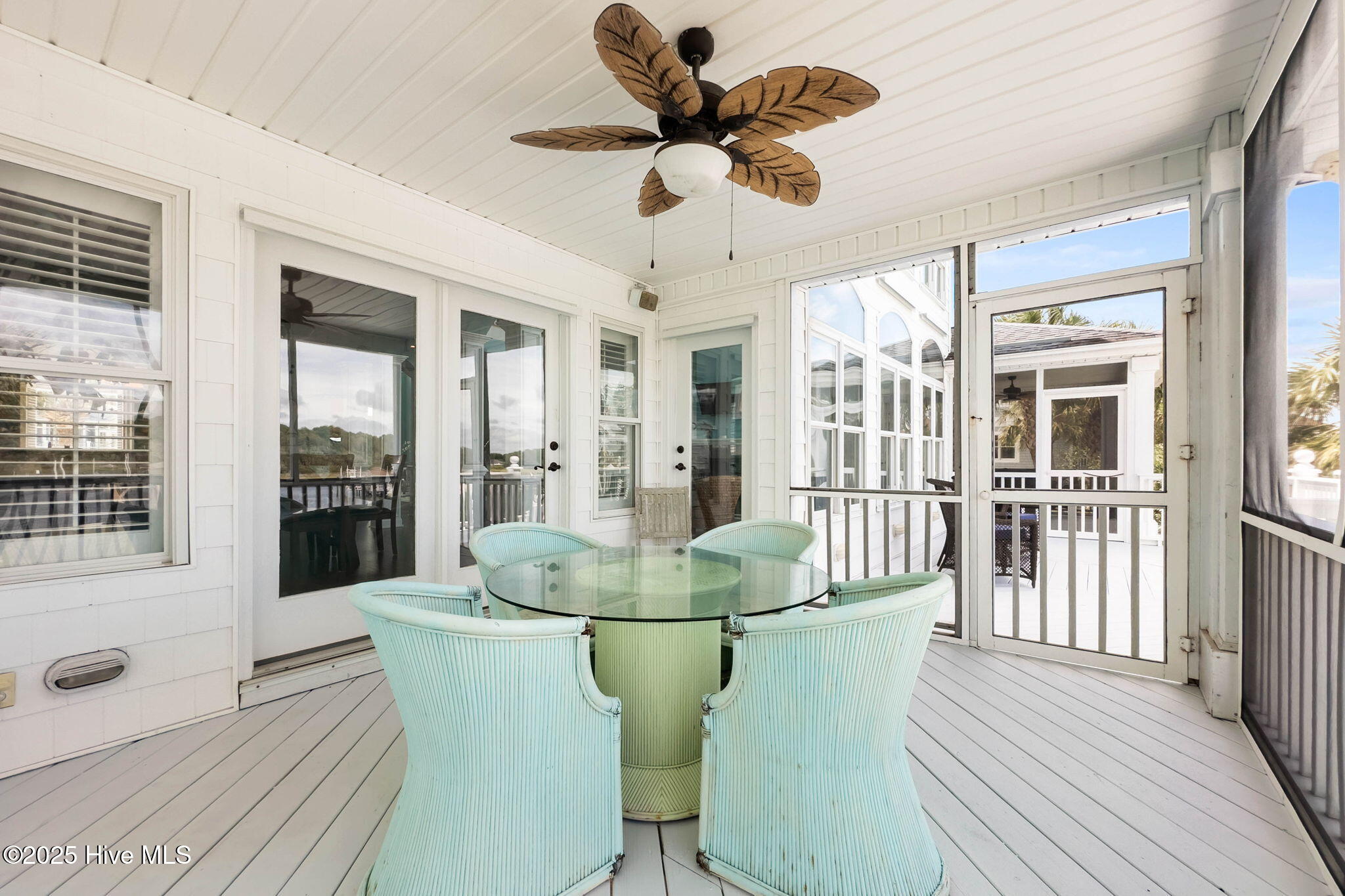 57 Craven Street Ocean Isle Beach, NC 28469 - Photo 27 of 85 Exceptional ICW-front home featuring 5 bedrooms, 5.5 baths, breathtaking water views, private dock with boat lift, and a resort-style outdoor space with pool, porches, and deck.