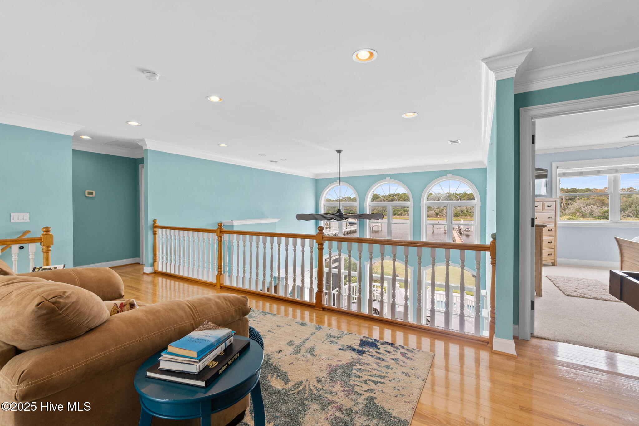 57 Craven Street Ocean Isle Beach, NC 28469 - Photo 36 of 85 Exceptional ICW-front home featuring 5 bedrooms, 5.5 baths, breathtaking water views, private dock with boat lift, and a resort-style outdoor space with pool, porches, and deck.