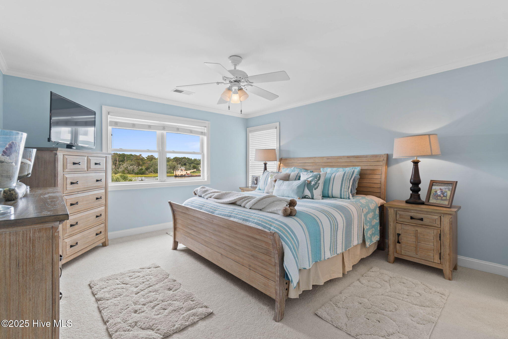 57 Craven Street Ocean Isle Beach, NC 28469 - Photo 37 of 85 Exceptional ICW-front home featuring 5 bedrooms, 5.5 baths, breathtaking water views, private dock with boat lift, and a resort-style outdoor space with pool, porches, and deck.