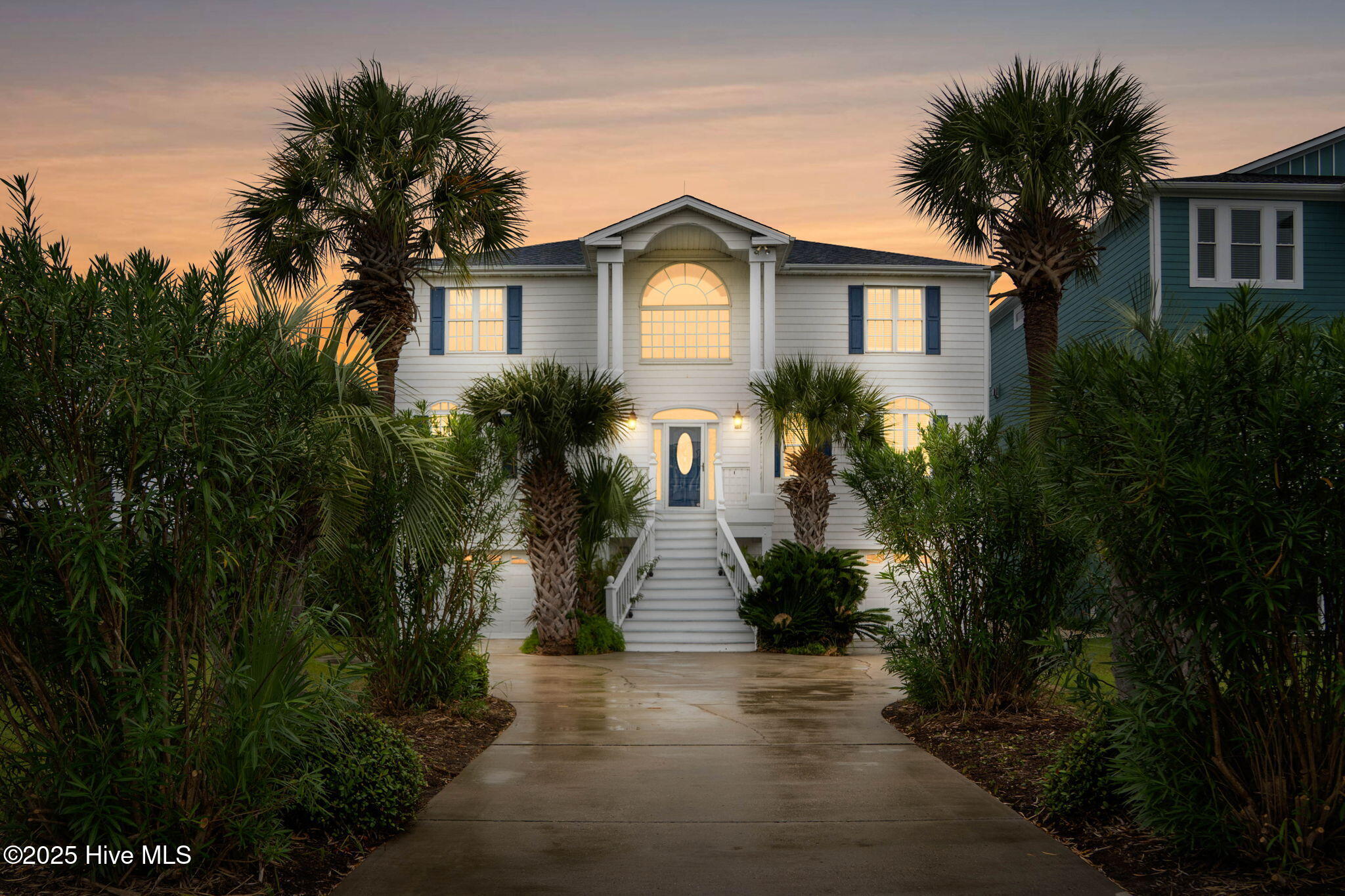 57 Craven Street Ocean Isle Beach, NC 28469 - Photo 3 of 85 Exceptional ICW-front home featuring 5 bedrooms, 5.5 baths, breathtaking water views, private dock with boat lift, and a resort-style outdoor space with pool, porches, and deck.