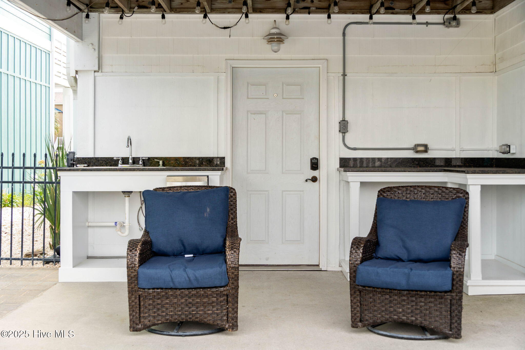 57 Craven Street Ocean Isle Beach, NC 28469 - Photo 52 of 85 Exceptional ICW-front home featuring 5 bedrooms, 5.5 baths, breathtaking water views, private dock with boat lift, and a resort-style outdoor space with pool, porches, and deck.