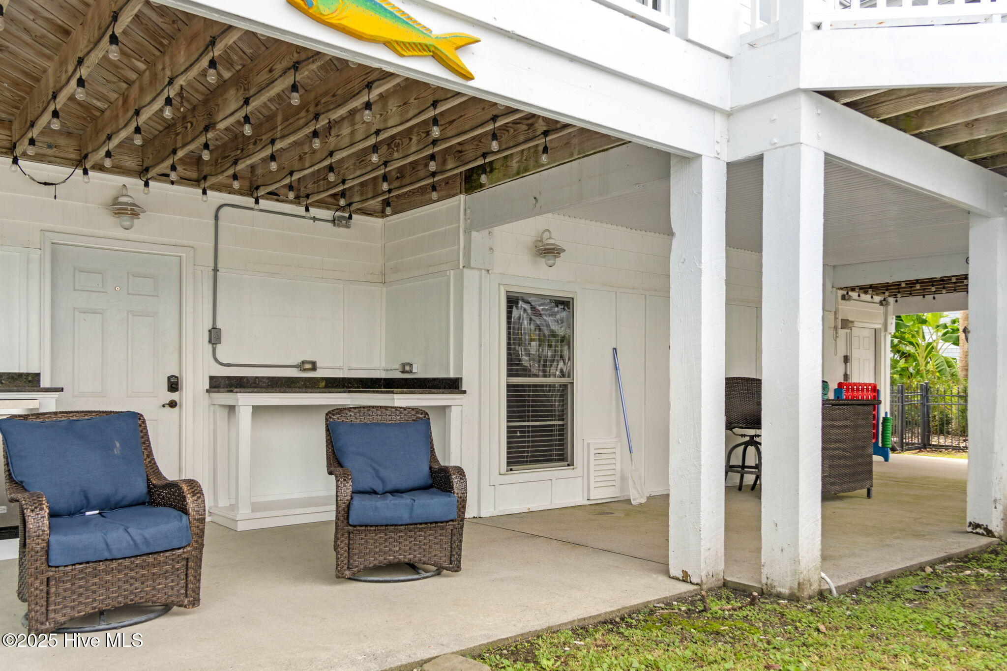 57 Craven Street Ocean Isle Beach, NC 28469 - Photo 53 of 85 Exceptional ICW-front home featuring 5 bedrooms, 5.5 baths, breathtaking water views, private dock with boat lift, and a resort-style outdoor space with pool, porches, and deck.