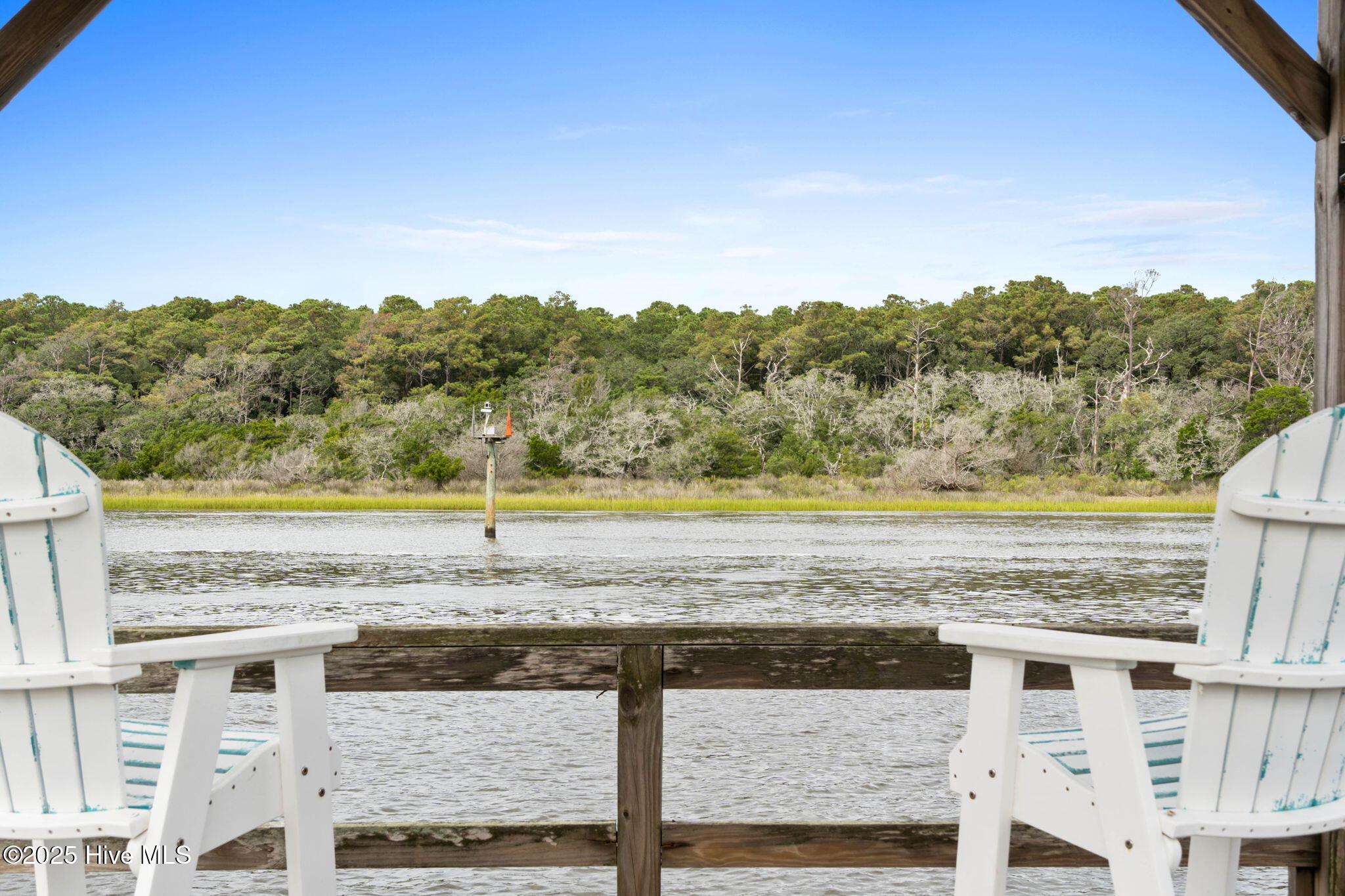 57 Craven Street Ocean Isle Beach, NC 28469 - Photo 61 of 85 Exceptional ICW-front home featuring 5 bedrooms, 5.5 baths, breathtaking water views, private dock with boat lift, and a resort-style outdoor space with pool, porches, and deck.