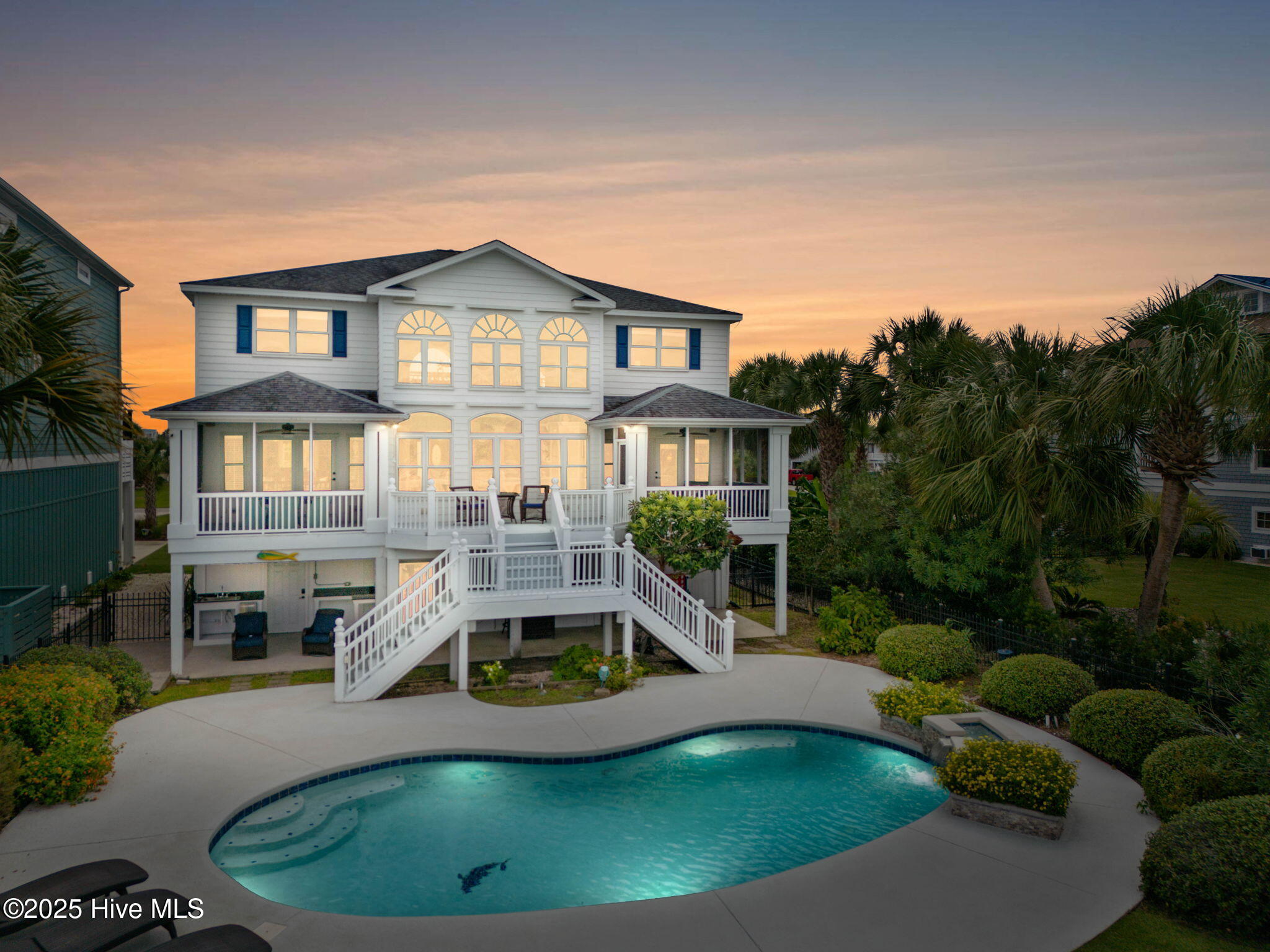 57 Craven Street Ocean Isle Beach, NC 28469 - Photo 62 of 85 Exceptional ICW-front home featuring 5 bedrooms, 5.5 baths, breathtaking water views, private dock with boat lift, and a resort-style outdoor space with pool, porches, and deck.