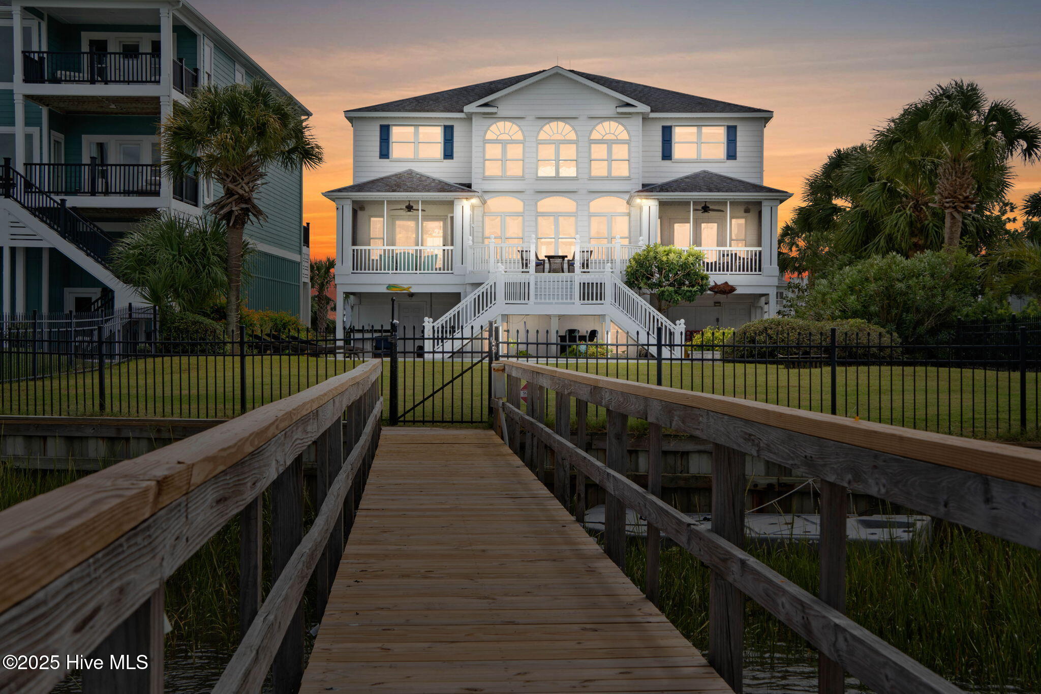 57 Craven Street Ocean Isle Beach, NC 28469 - Photo 5 of 85 Exceptional ICW-front home featuring 5 bedrooms, 5.5 baths, breathtaking water views, private dock with boat lift, and a resort-style outdoor space with pool, porches, and deck.