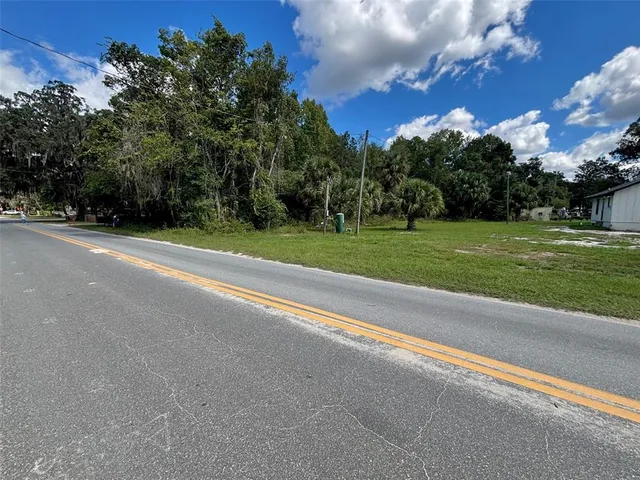 a view of a golf course with a house