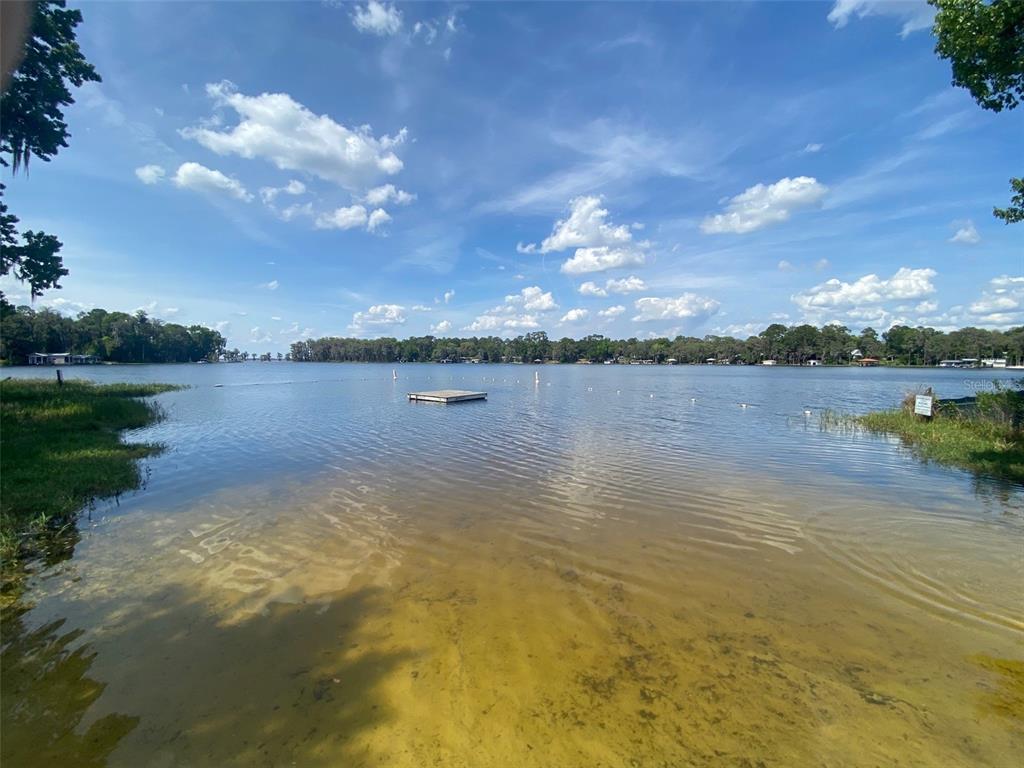 404 Grove Street Melrose, FL 32666 - Photo 15 of 50 a view of a lake with houses in the background