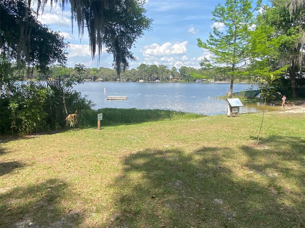 404 Grove Street Melrose, FL 32666 - Photo 35 of 50 a view of a lake with a yard