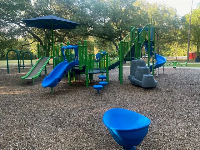 a view of a backyard with sitting area