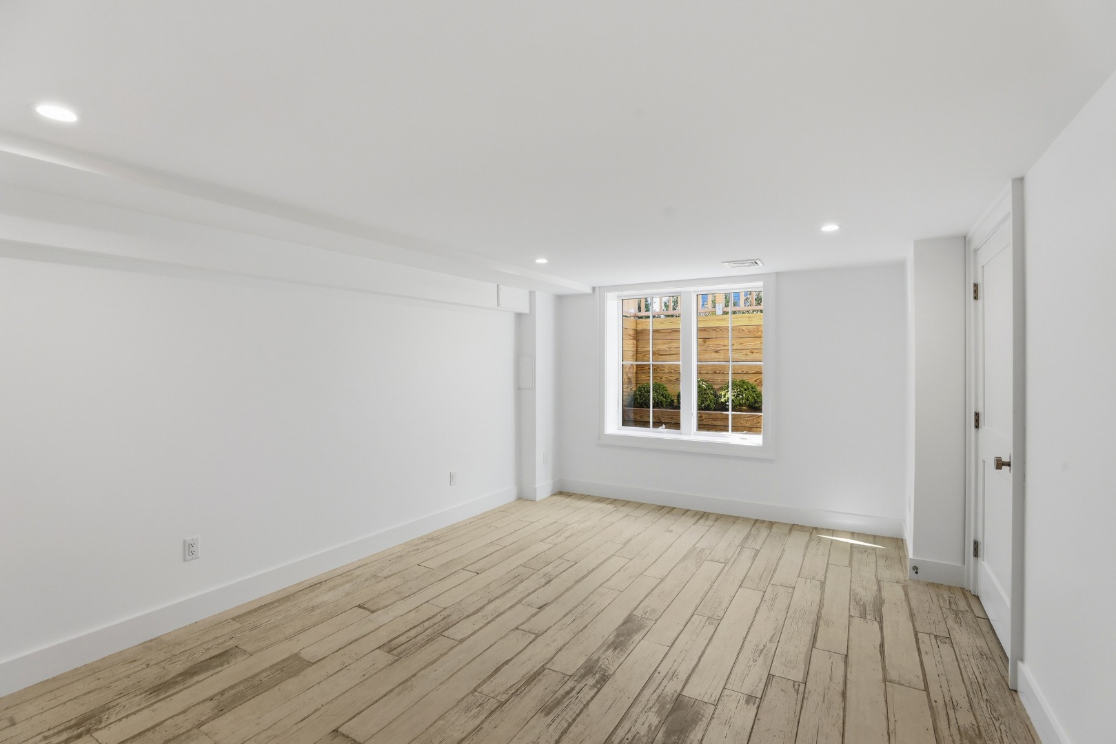 10 Rudder Lane Nantucket, MA 02554 - Photo 30 of 33 a view of an empty room with wooden floor and a window