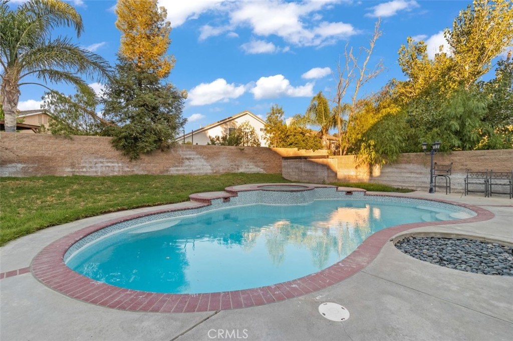 14439 Grandifloras Road Canyon Country, CA 91387 - Photo 40 of 44 a view of a swimming pool with a yard