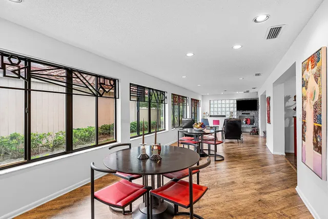 a living room with a bed couch and a large window with outer view