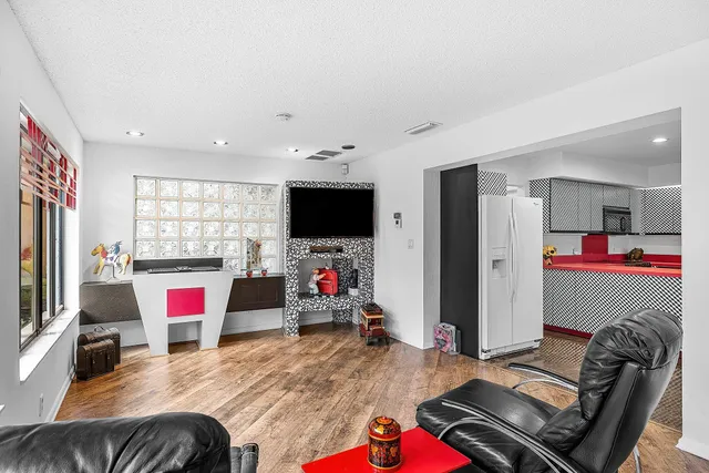 a bed room with a bed and a television