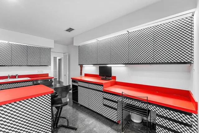 a kitchen with a sink and cabinets