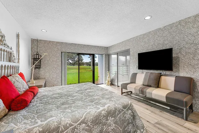 a aerial view of a house with a yard table and chairs