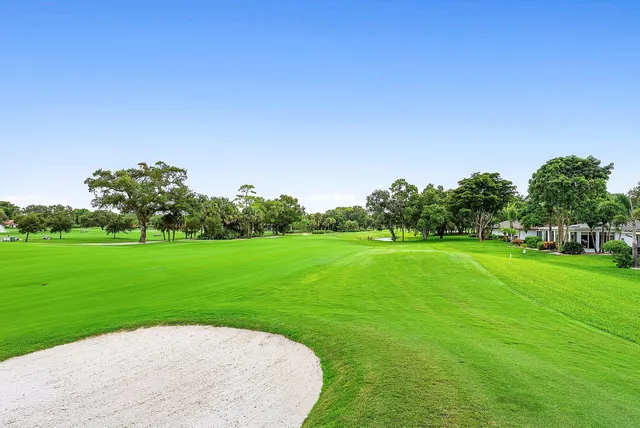 a view of a swimming pool with an outdoor seating