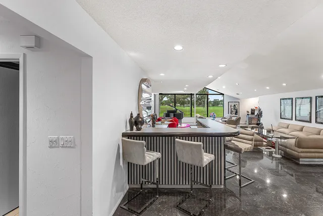 a kitchen with sink cabinets and outdoor view