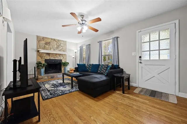 a living room with furniture and a fireplace