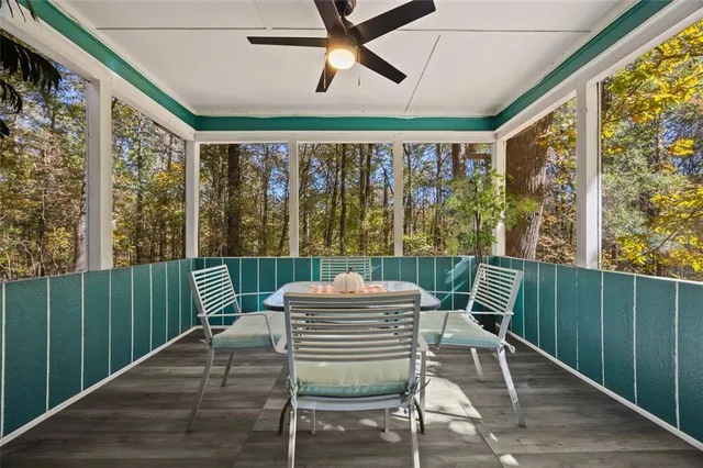 a view of a chairs and table in the balcony
