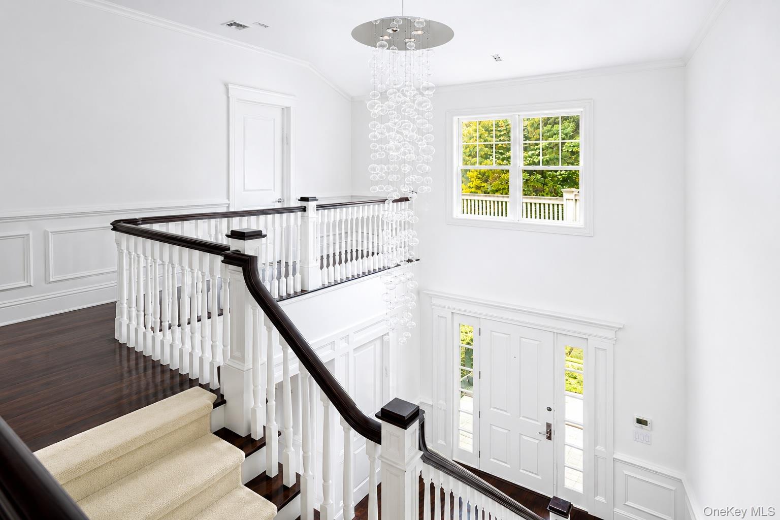 486 Middle Line Highway Bridgehampton, NY 11976 - Photo 13 of 28 a view of an entryway with wooden floor and windows
