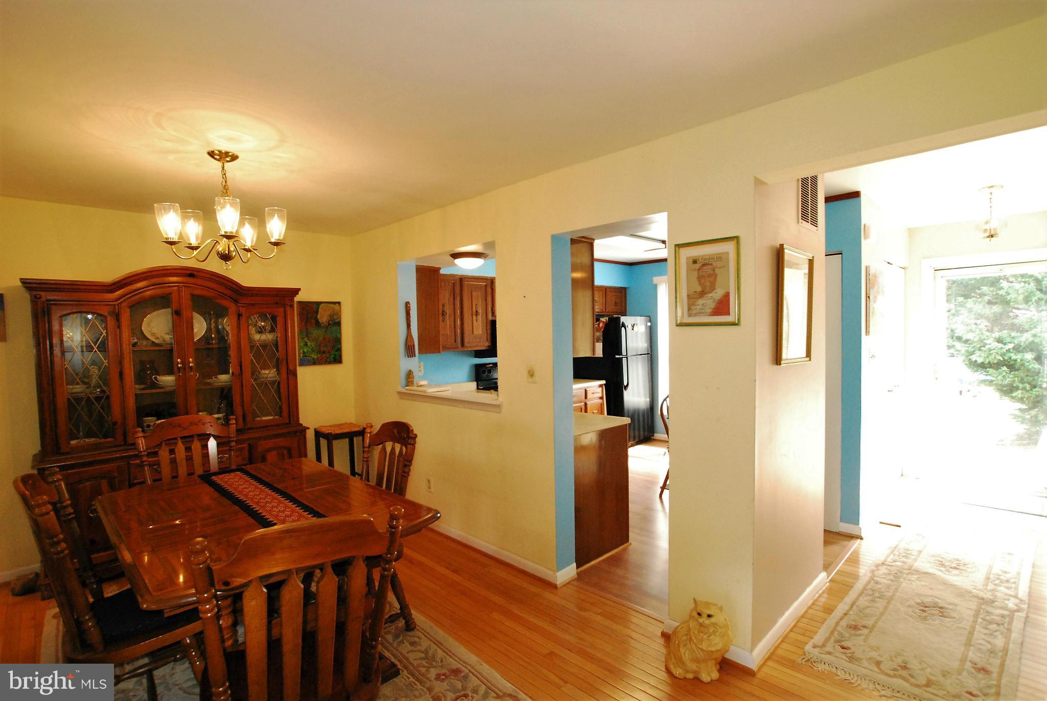 46 Robin Ridge Court Baltimore, MD 21234 - Photo 5 of 22 a view of a dining room with furniture and chandelier