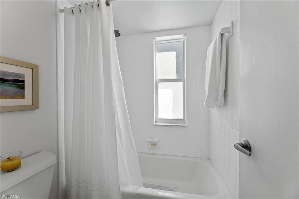 263 Candycane Lane, Unit 7 Naples, FL 34112 - Photo 27 of 50 a bathroom with a shower