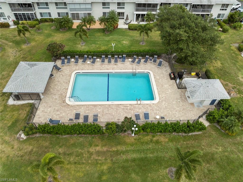 263 Candycane Lane, Unit 7 Naples, FL 34112 - Photo 31 of 50 an aerial view of a house with a yard basket ball court and outdoor seating