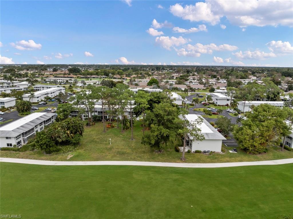 263 Candycane Lane, Unit 7 Naples, FL 34112 - Photo 37 of 50 a view of a city