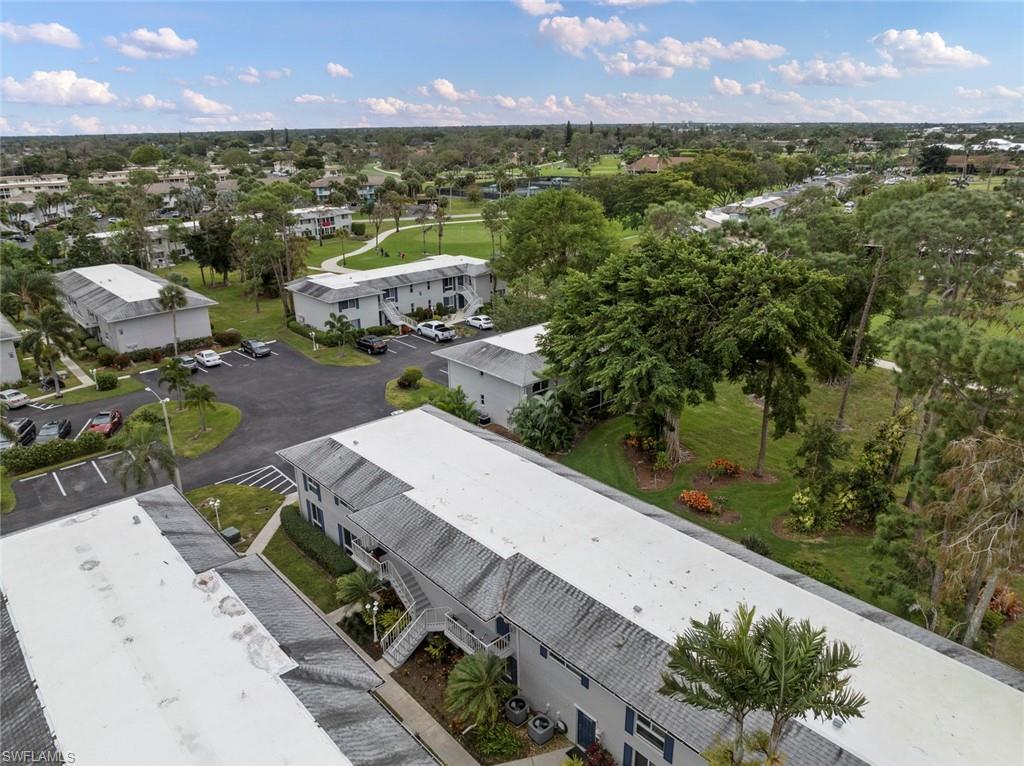 263 Candycane Lane, Unit 7 Naples, FL 34112 - Photo 38 of 50 an aerial view of a house with a yard