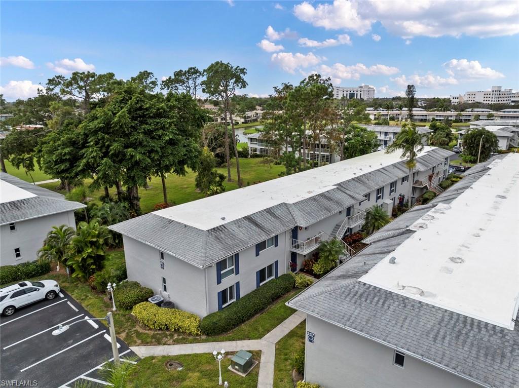 263 Candycane Lane, Unit 7 Naples, FL 34112 - Photo 40 of 50 a view of a houses with a terrace