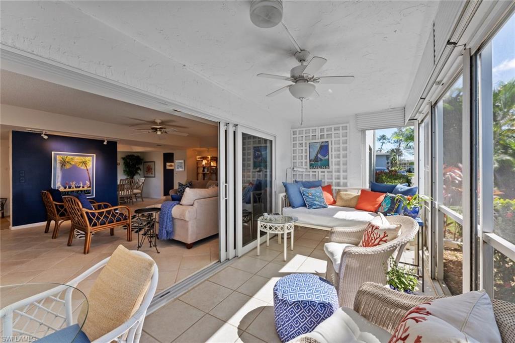 263 Candycane Lane, Unit 7 Naples, FL 34112 - Photo 9 of 50 a view of a livingroom with furniture window and outside view