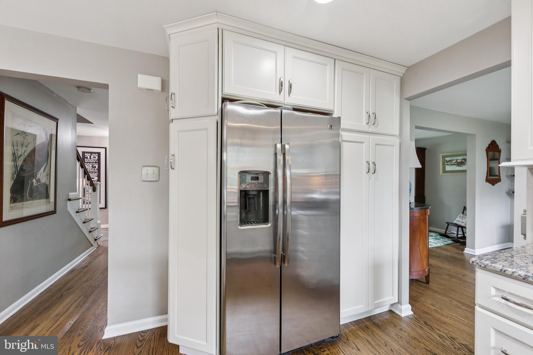 15 Oakford Road Wayne, PA 19087 - Photo 12 of 54 a metallic refrigerator freezer sitting in a kitchen
