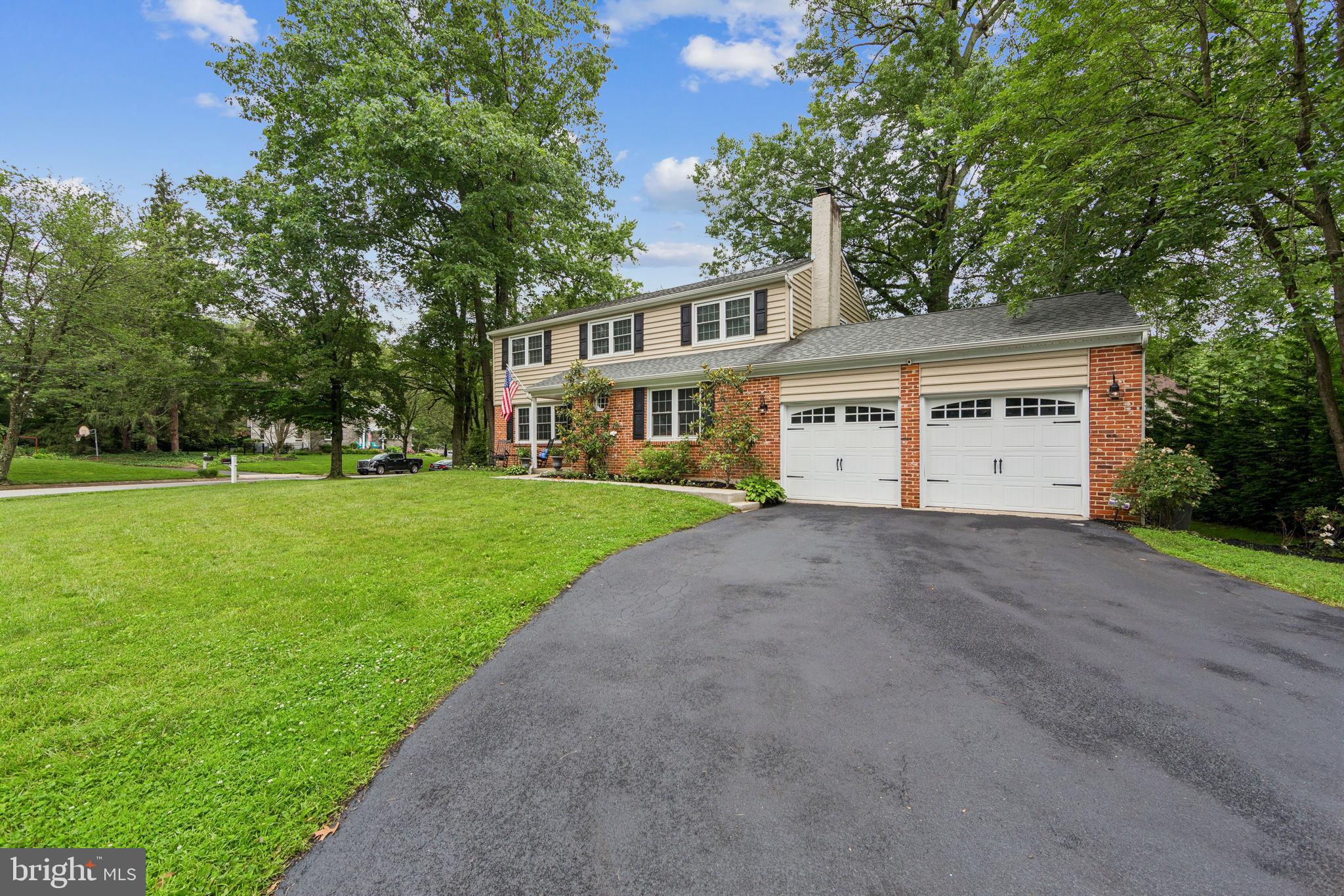 15 Oakford Road Wayne, PA 19087 - Photo 2 of 54 a view of a white house with a big yard and large trees