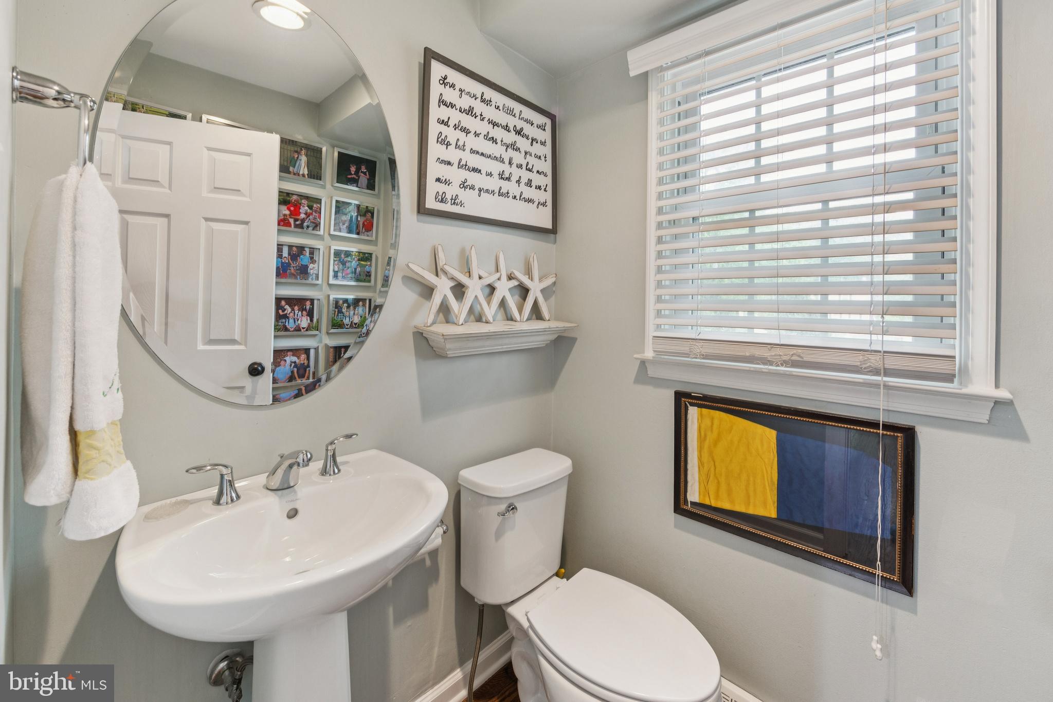 15 Oakford Road Wayne, PA 19087 - Photo 21 of 54 a bathroom with a sink a mirror and a toilet