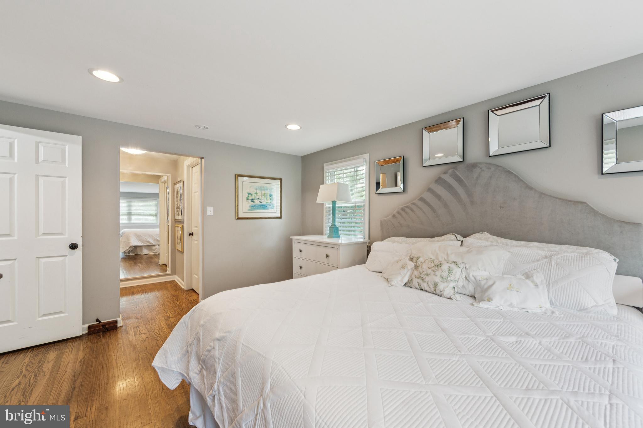 15 Oakford Road Wayne, PA 19087 - Photo 23 of 54 a bedroom with a large bed and a wooden floor