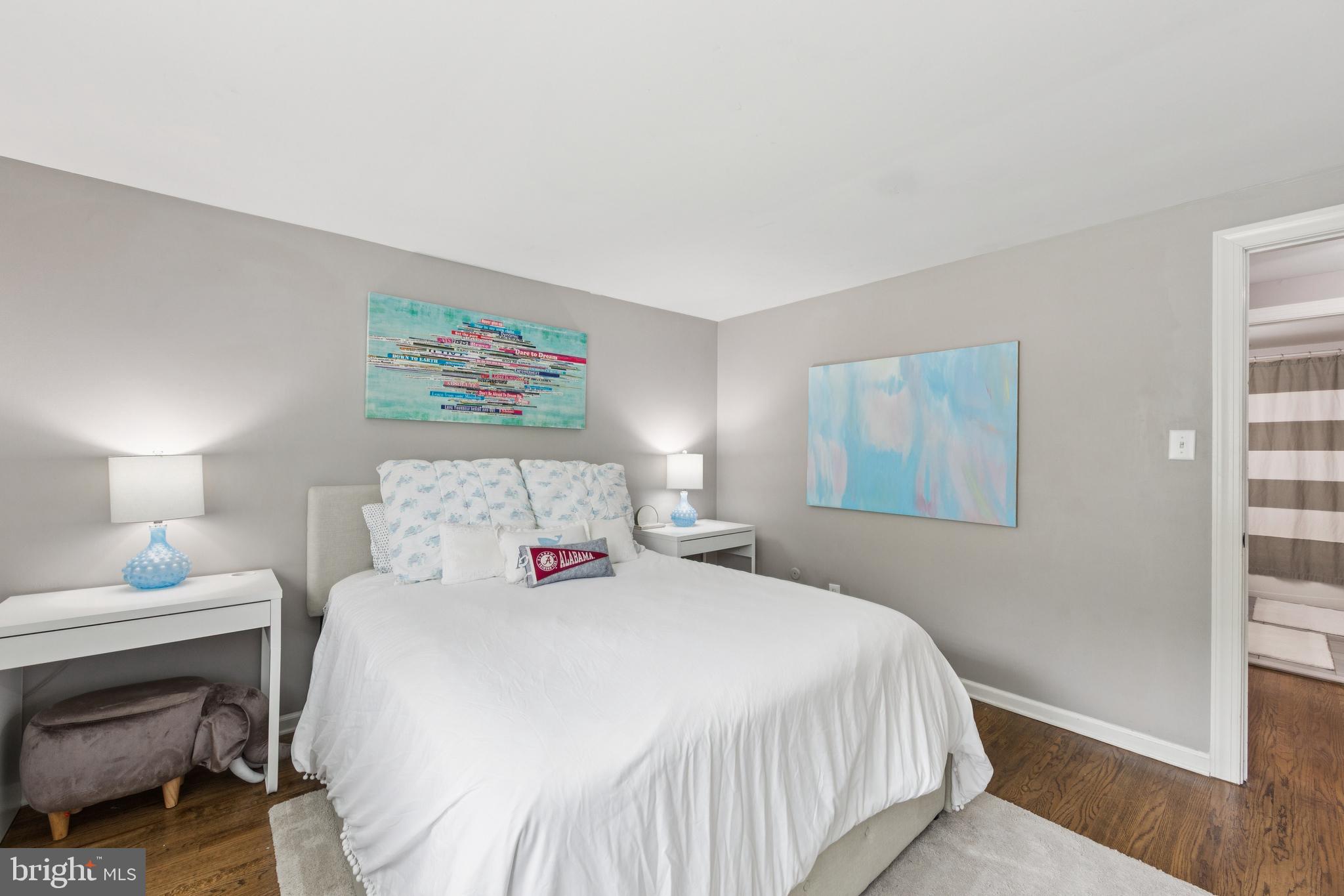 15 Oakford Road Wayne, PA 19087 - Photo 29 of 54 a bedroom with a bed and a painting on the wall