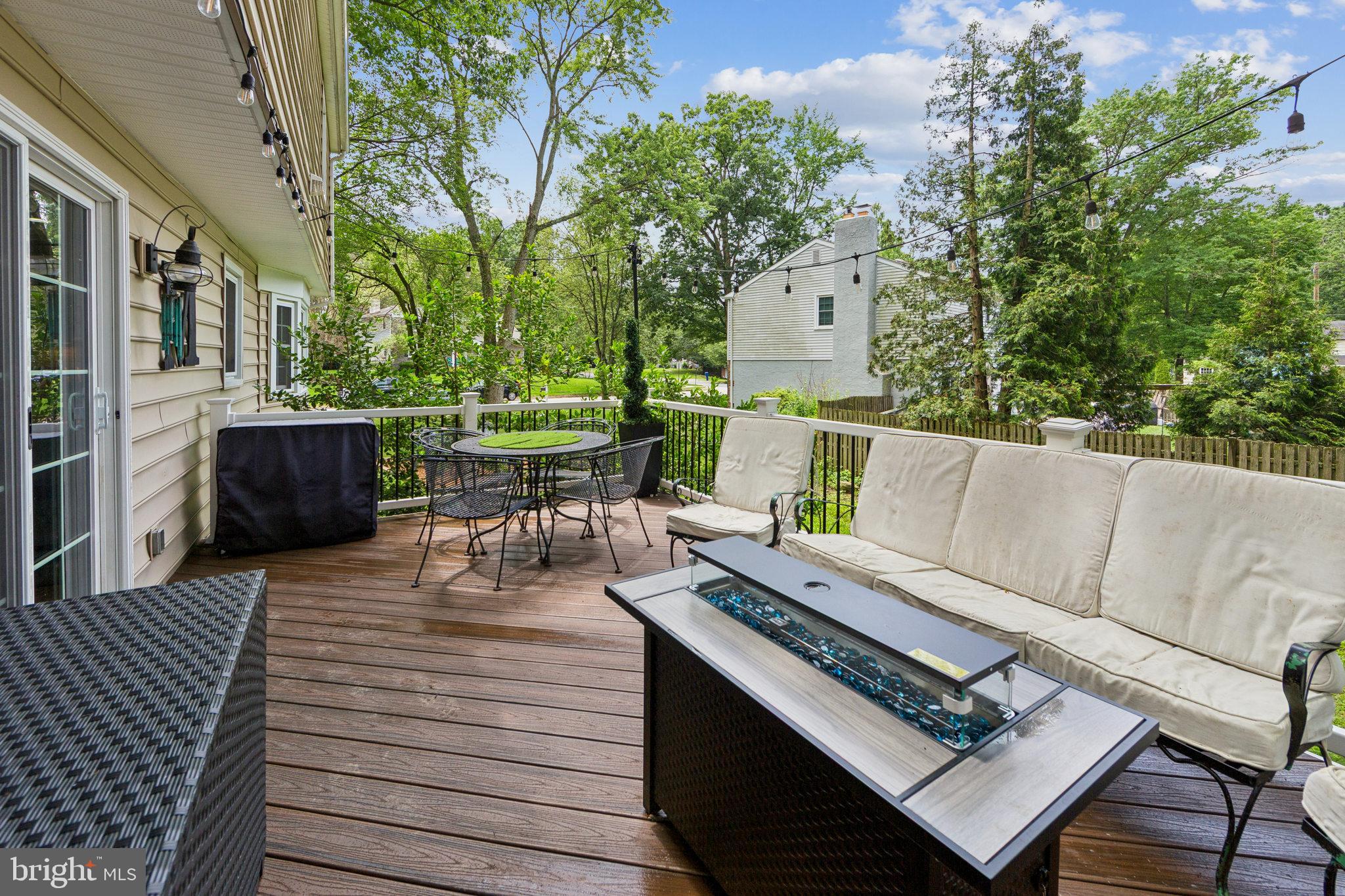 15 Oakford Road Wayne, PA 19087 - Photo 38 of 54 a view of a patio with couches table and chairs and potted plants